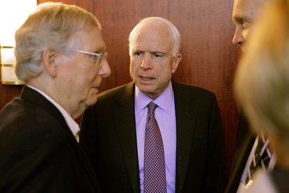 Sens. Mitch McConnell and John McCain have a quick chat.