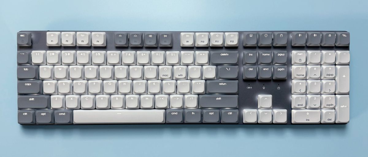 The Satechi SM3 mechanical keyboard against a blue background.