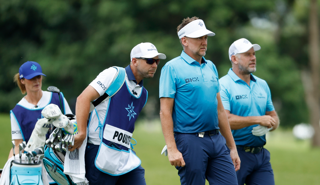 Majesticks GC&#039;s Ian Poulter and Lee Westwood walk off the fairway