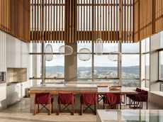 nova lima apartment interior showing dining area and long views