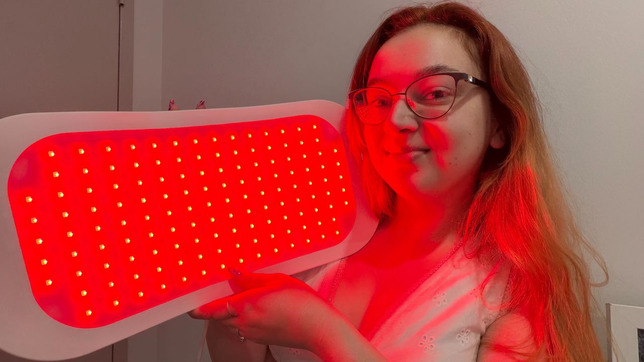 Woman using LED light panel