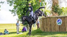 Caroline Pamukcu and HSH Blake seal their selection for the US squad at the 2026 eventing World Championships with second in the five-star at Kentucky &ndash;&nbsp;they are pictured dropping down a big step on the cross-country.