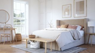 render of bedroom with bed, wooden bench at base of bed, wooden desk/dressing table and chairs, wooden floor, rug and artwork on walls with large full height window