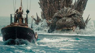A screenshot showing Godzilla chasing a fishing boat in Godzilla Minus One, one of the best Netflix movies