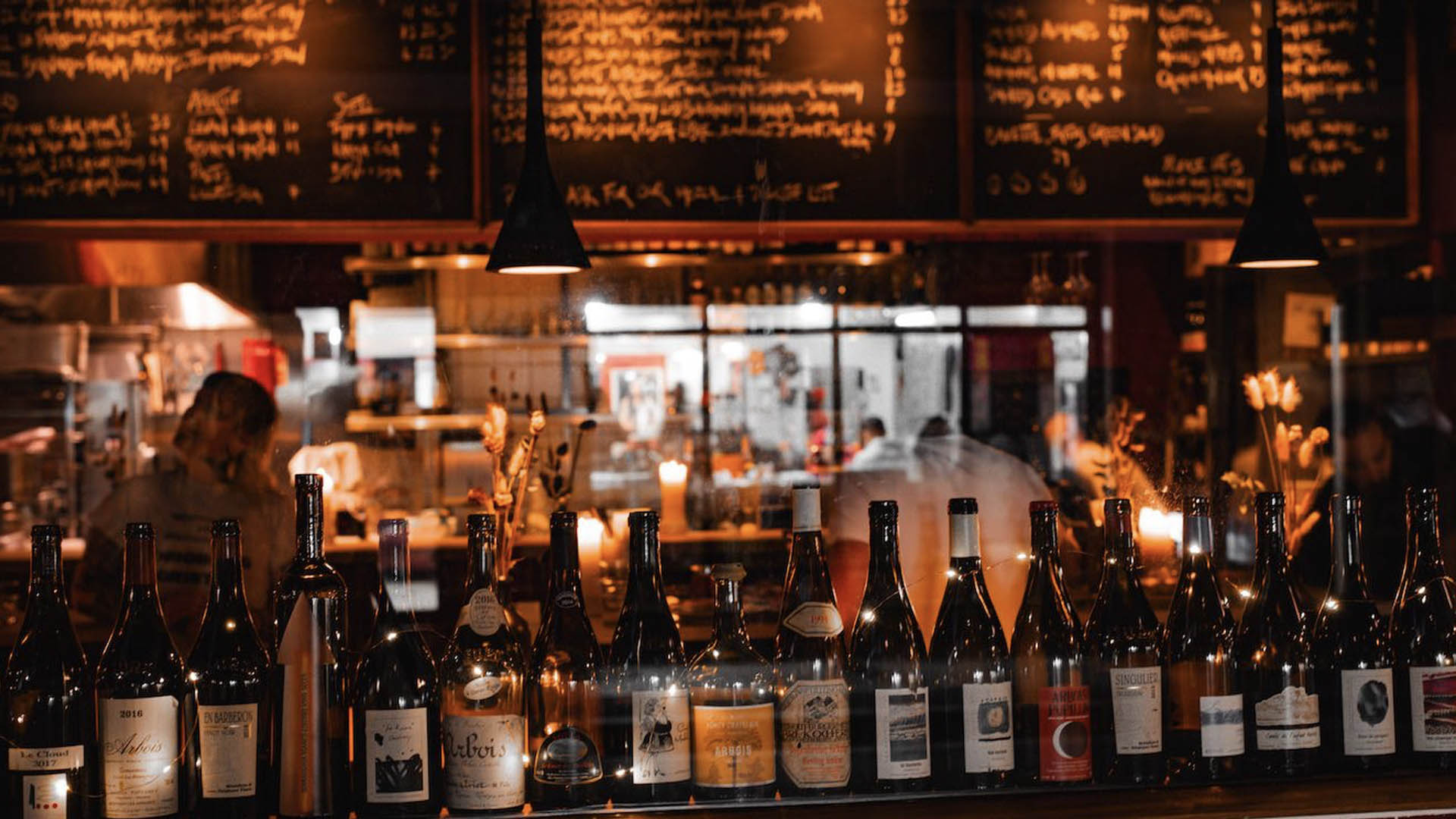 A photo of a series of bottles on a bar.