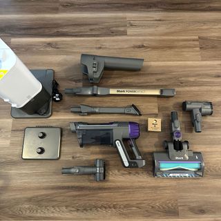 What you get in the box of the Shark PowerDetect Clean and Empty cordless vacuum cleaner, including crevice tools, attachments and dock