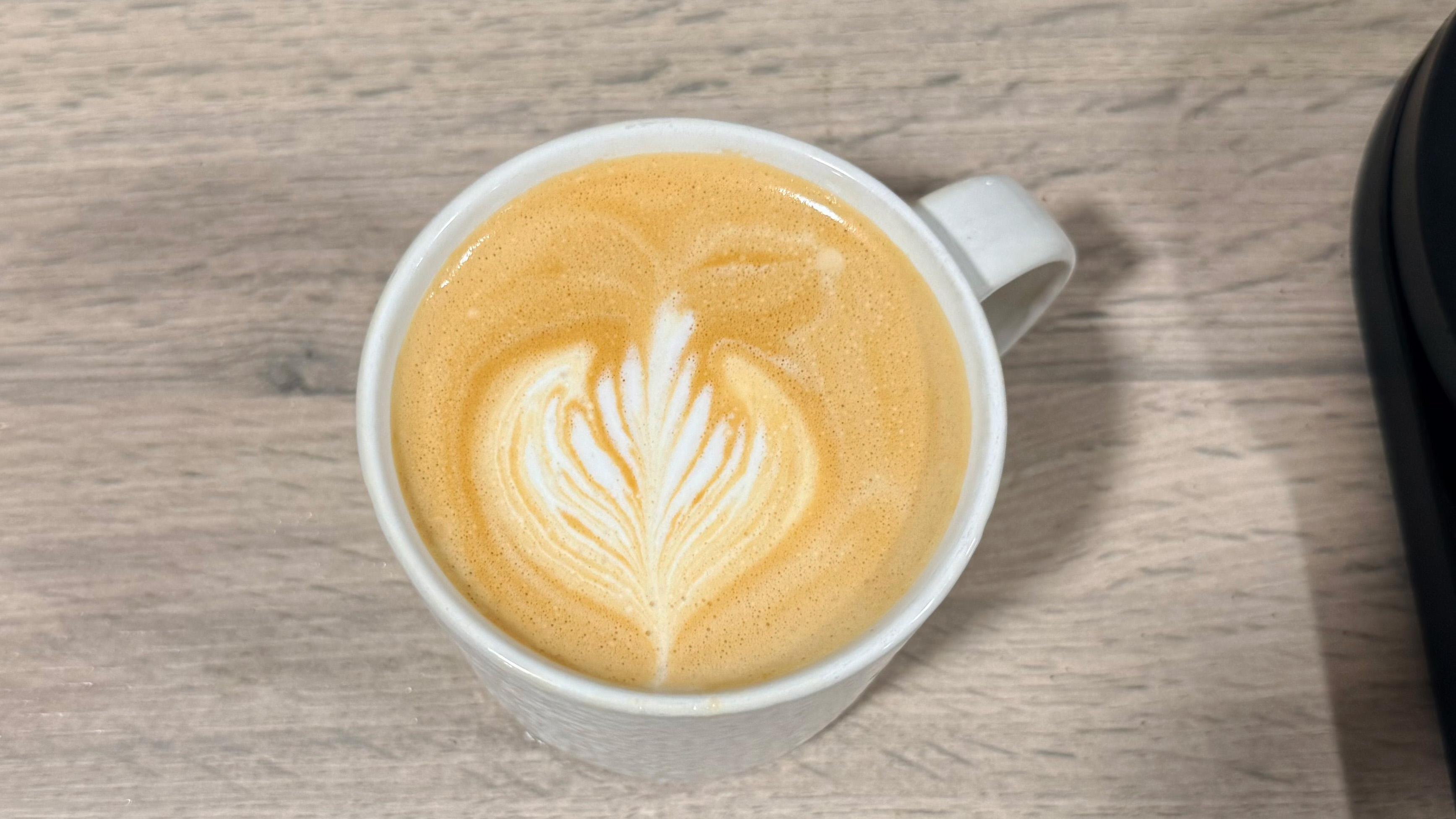 a picture of a drink made on the delonghi dedica duo