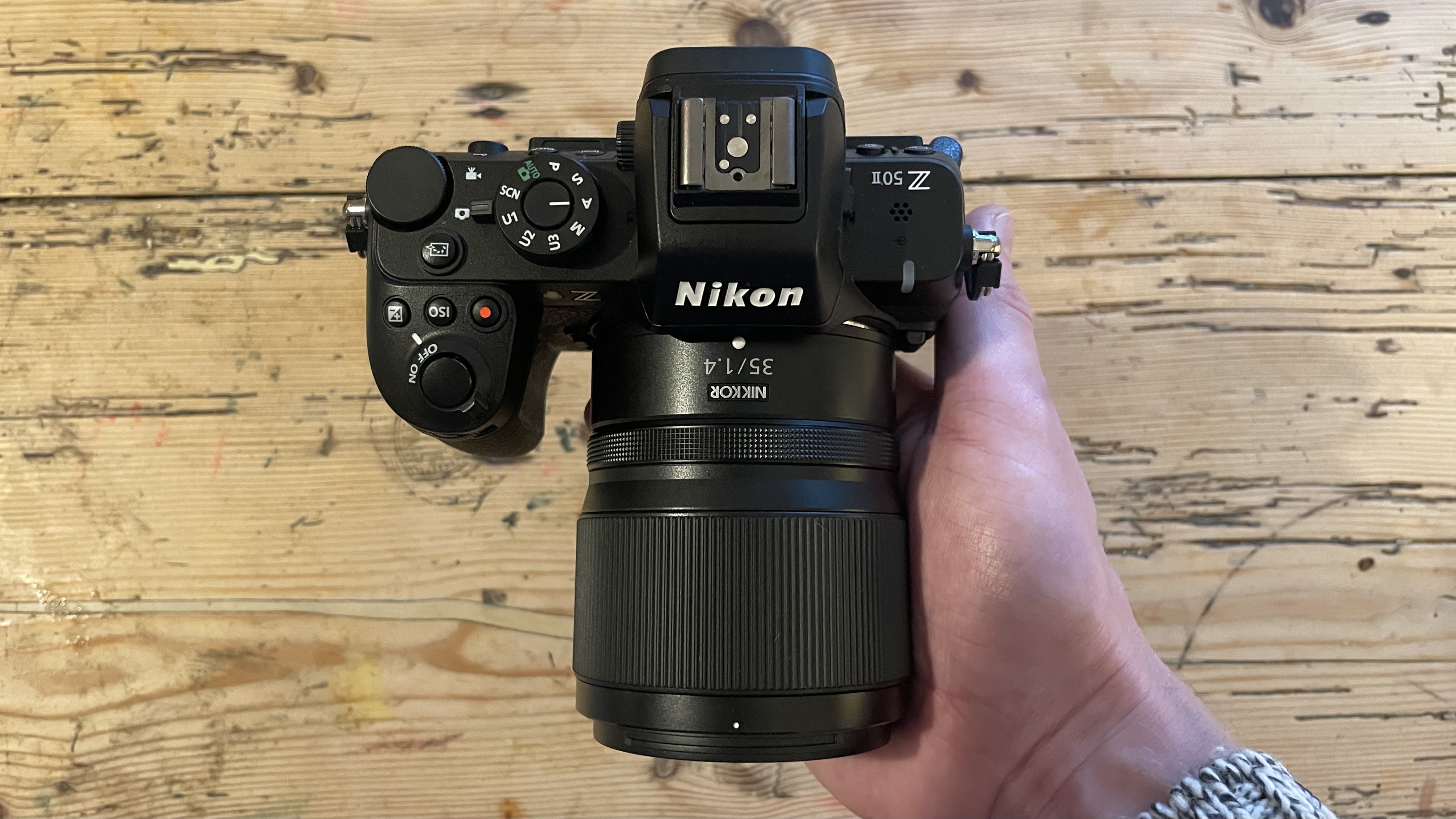 Nikon Z50 II mirrorless camera on a wooden tabletop