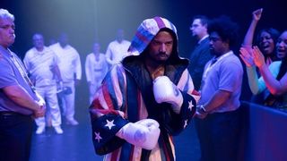 Michael B. Jordan in a boxing robe in Creed III