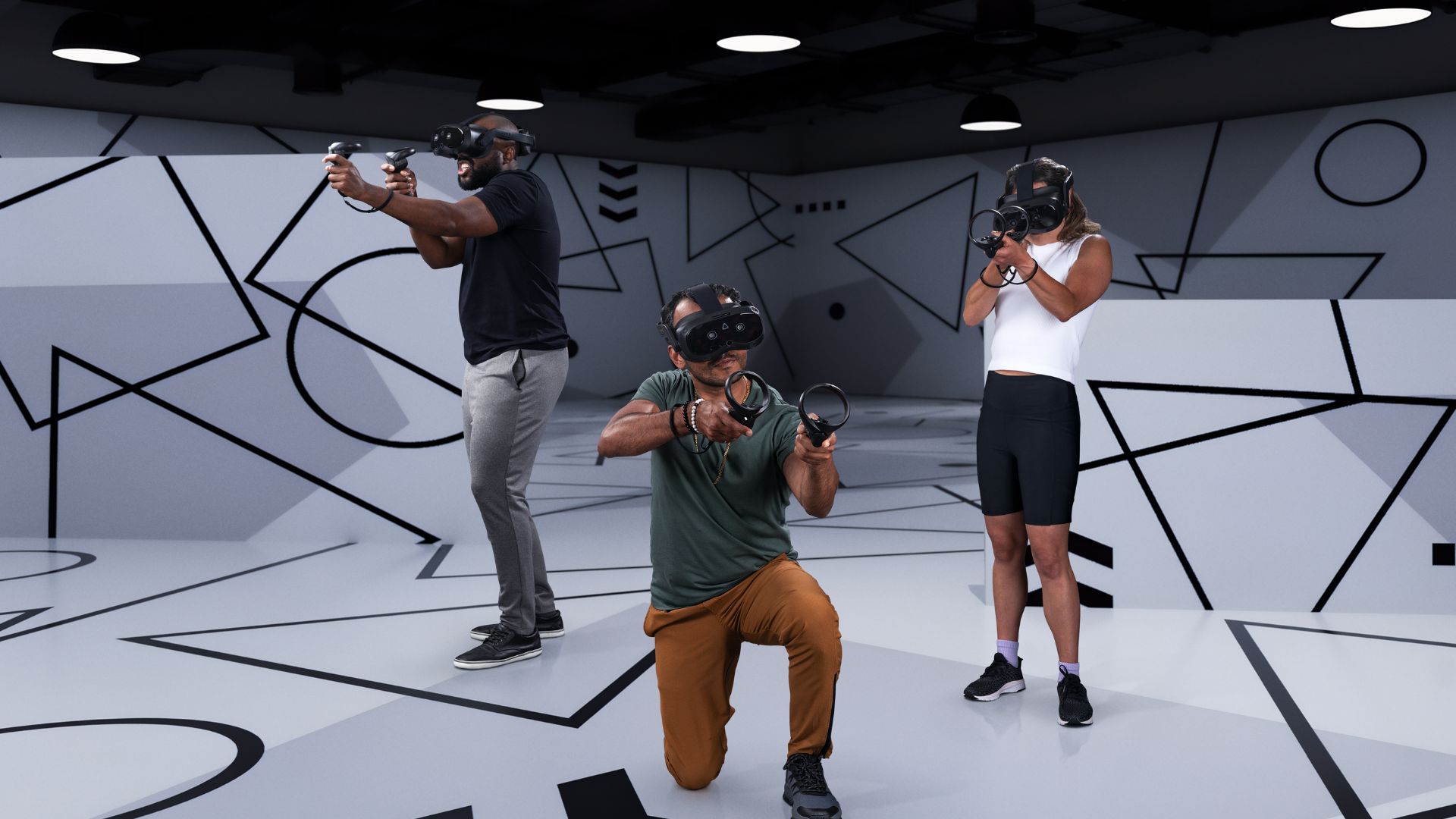 Lifestyle image of three people gaming with the HTC Vive Focus Vision