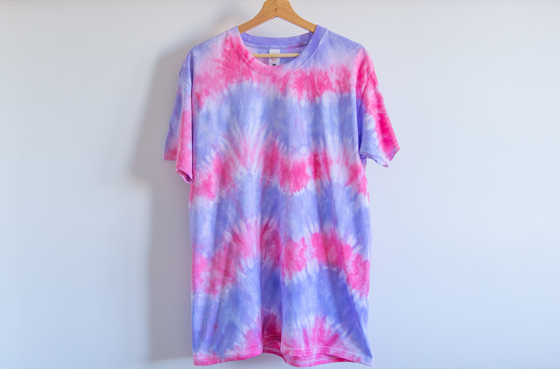 A t-shirt tie dyed with a chevron stripe