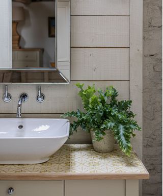 Bathroom basin with tiled countertop