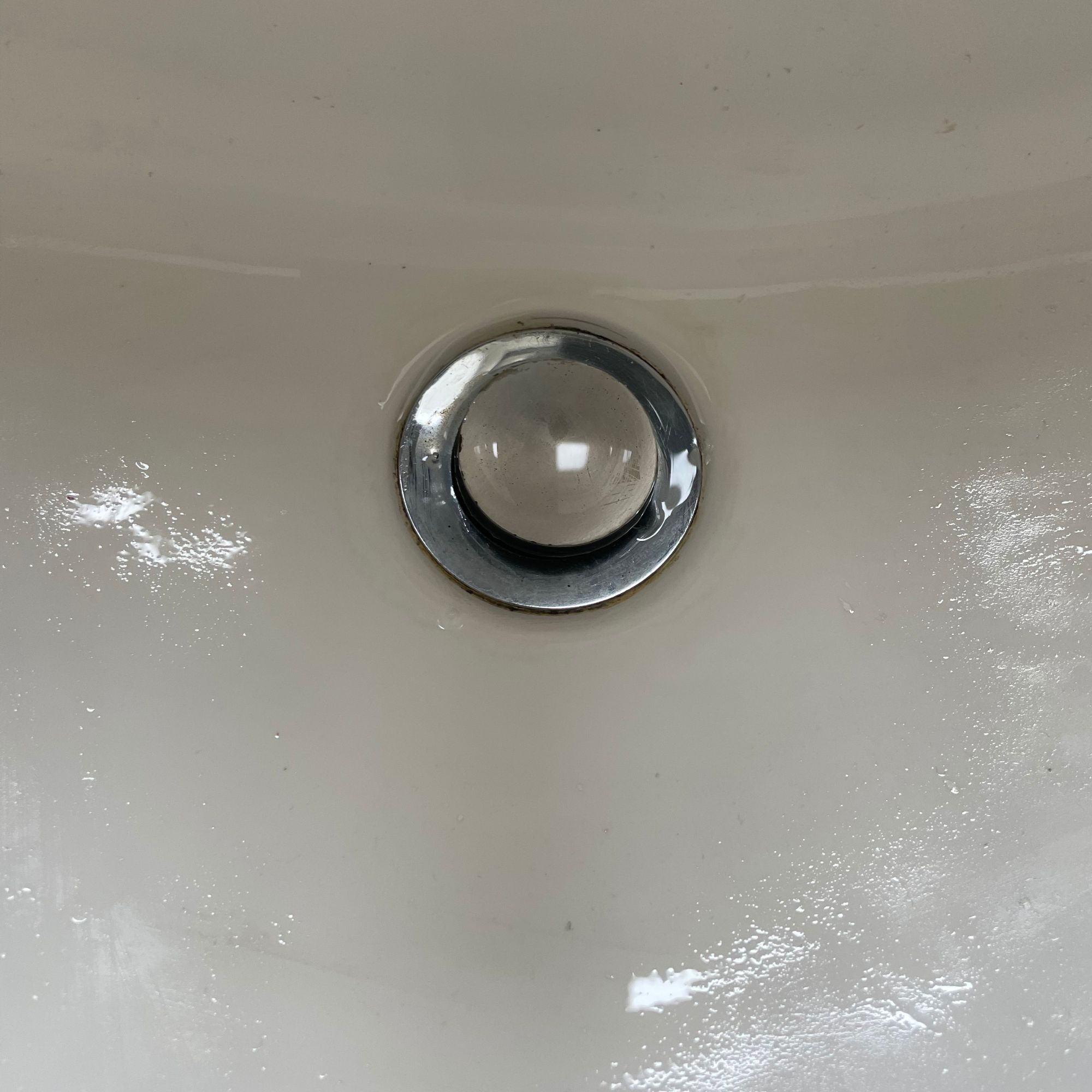 Clean sink and plughole after being steam cleaned