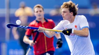  Floris Middendorp of Holland cradles the ball on his stick, in a white shirt, during the Netherlands vs Spain men's hockey match at the 2024 Paris Olympic Games. 