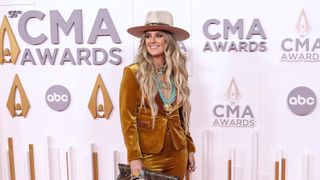 Lainey Wilson on the red carpet at 2022 CMAs