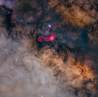 the dusty lanes of the milky way with a glowing bit towards the center