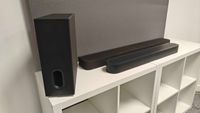 Sonos Beam Ultra and Sony Bravia Theatre Bar 7 + S on a white table