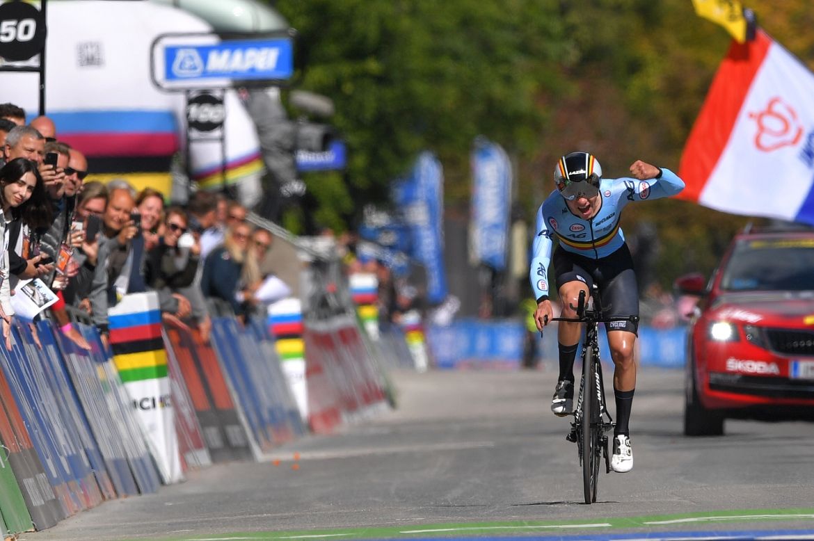 Remco Evenepoel celebrates as he crosses the line