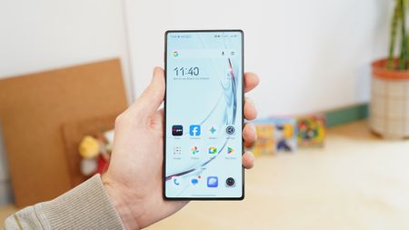 The Nubia Red Magic 11 Air being held in a hand