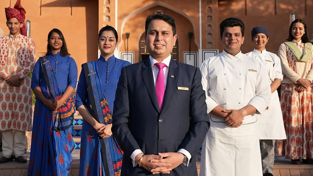 Staff stand outside a luxury hotel in India for Chanel 4&#039;s Grand Indian Hotel