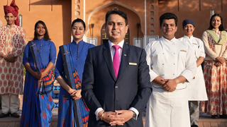Staff stand outside a luxury hotel in India for Chanel 4's Grand Indian Hotel