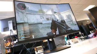 Dell S3222DGM gaming monitor on a desk.