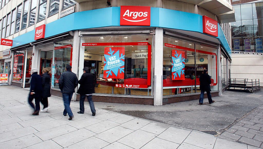 People walking past an Argos store