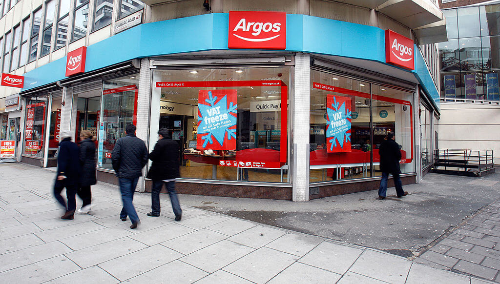 People walking past an Argos store