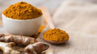tumeric in a bowl with spoon