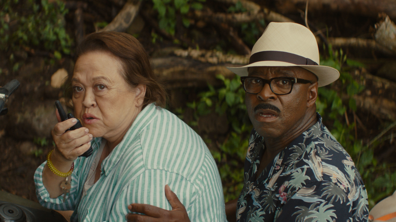 Amy Hill and Courtney B Vance watch on in concern while riding an ATV together in Lilo and Stitch.