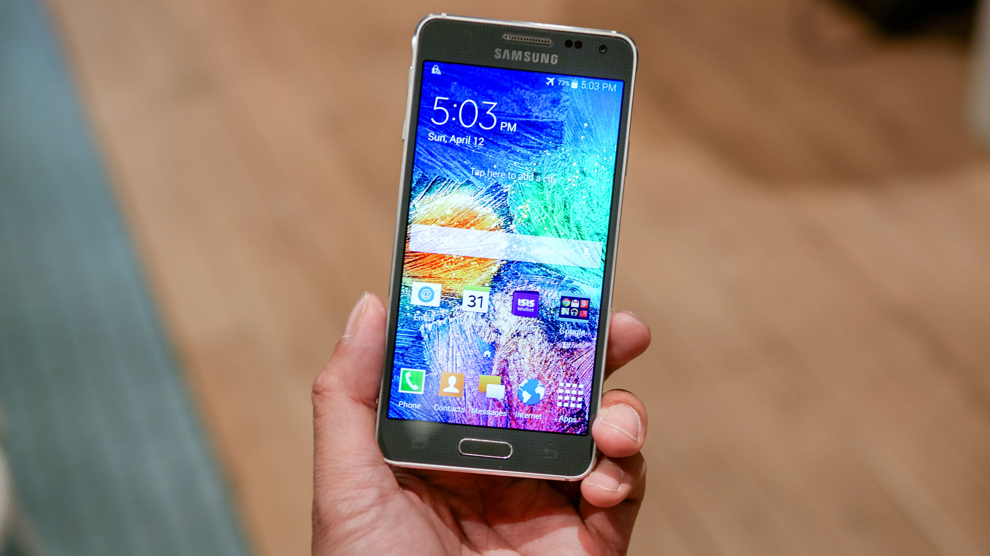 Samsung Galaxy Alpha held in hand.