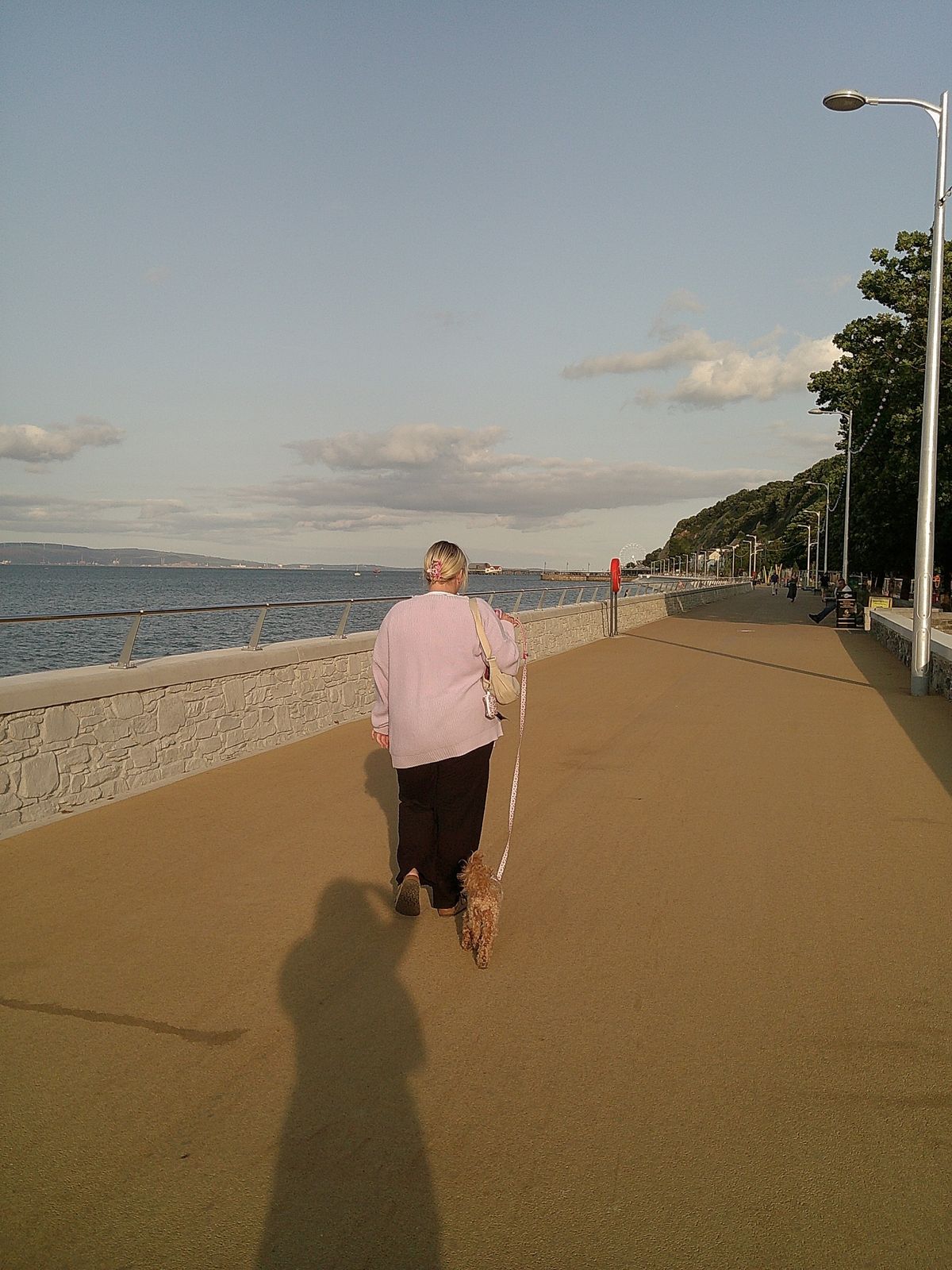 Image of a woman walking her dog taken with the Camp Snap Screen-Free Digital Camera