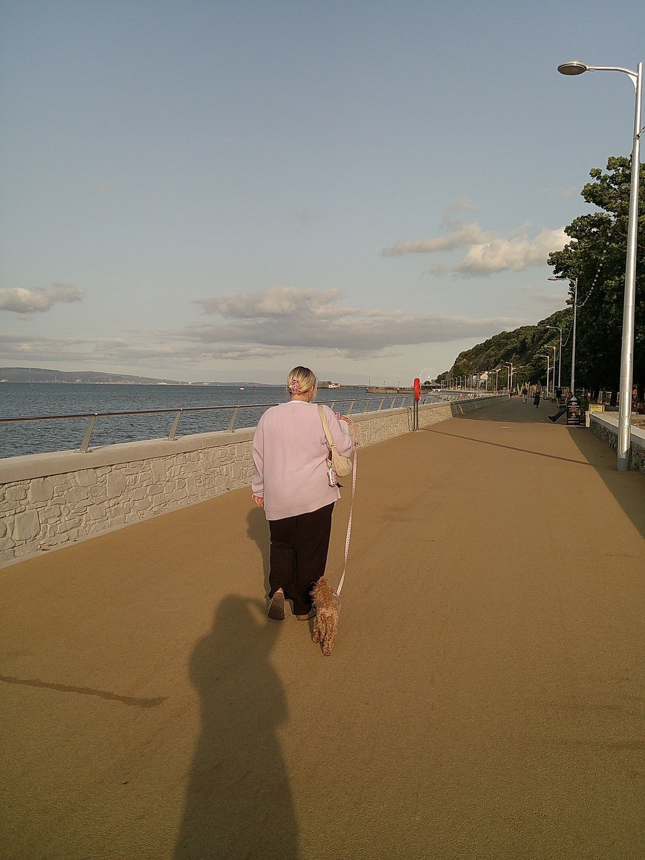 Image of a woman walking her dog taken with the Camp Snap Screen-Free Digital Camera