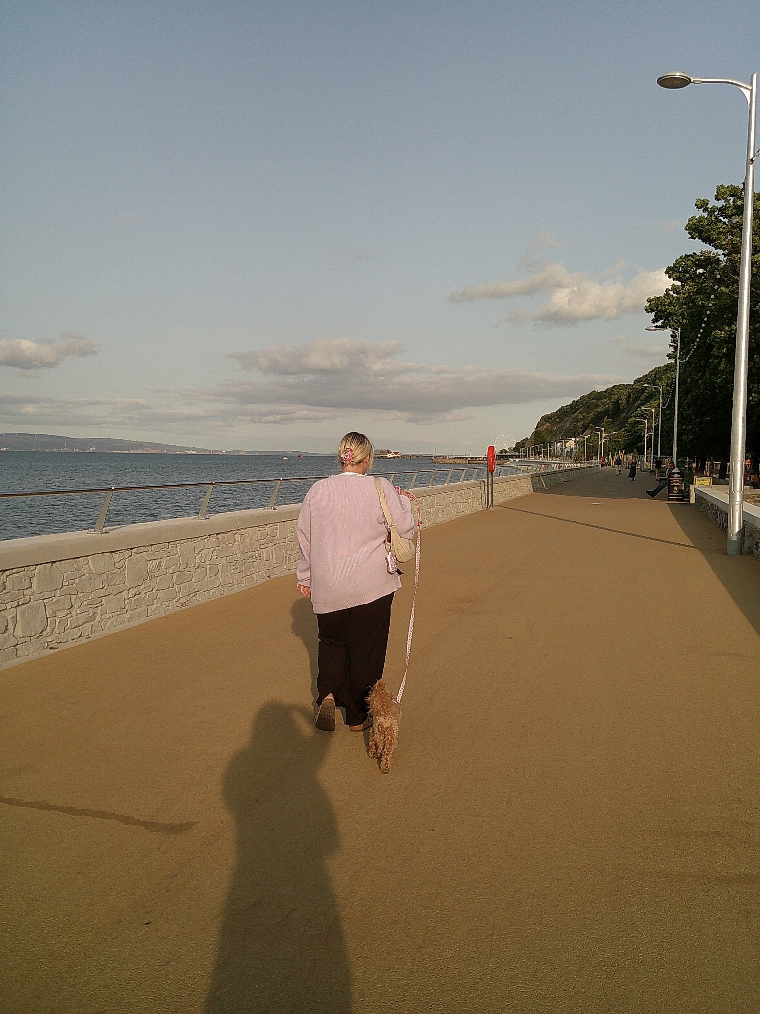 Image of a woman walking her dog taken with the Camp Snap Screen-Free Digital Camera