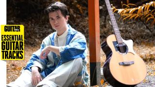 Marcin Patrzalek poses with an acoustic guitar