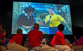 Videoconference between kids and Space Station astronauts
