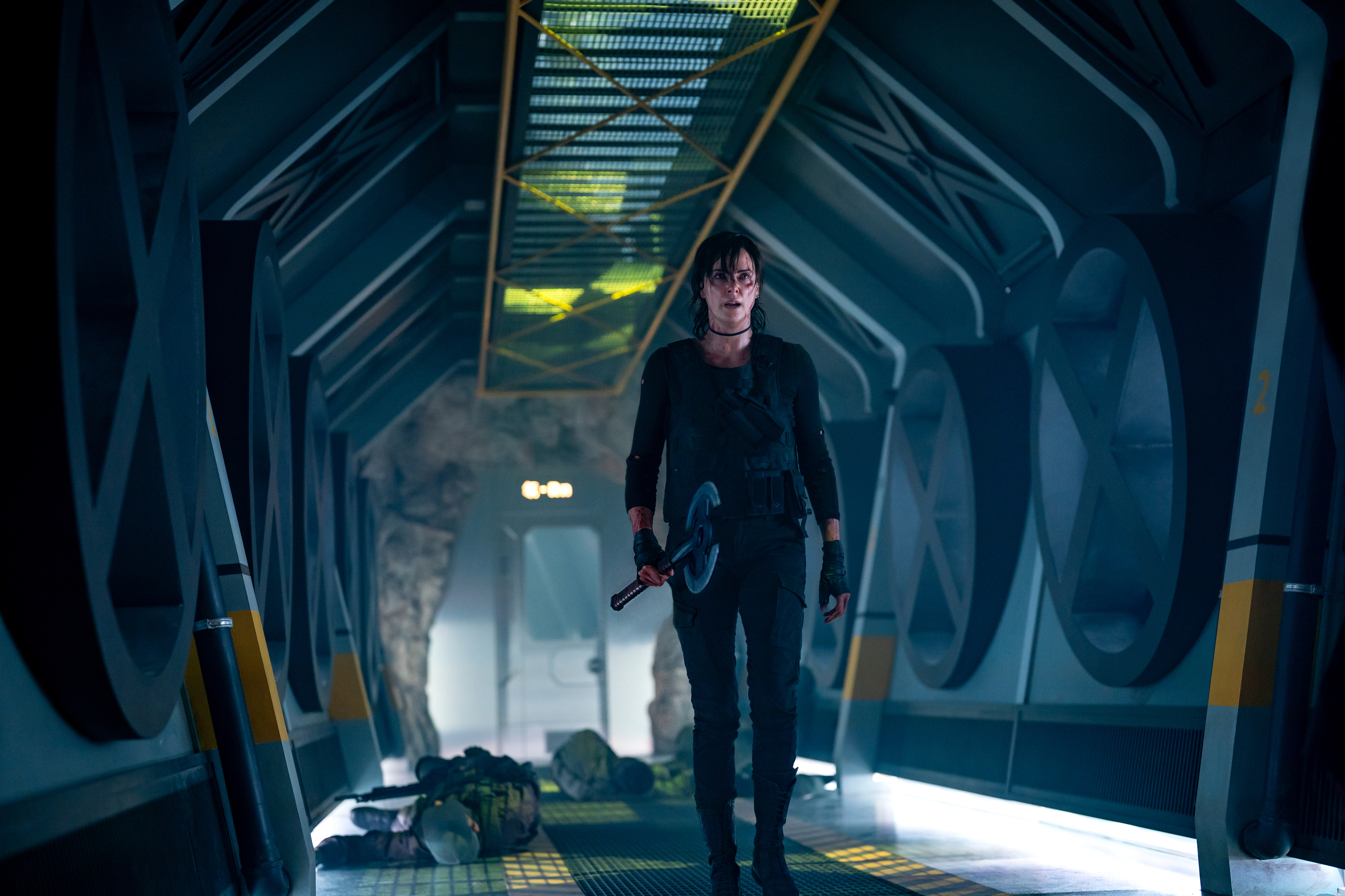 charlize theron as andy walking through a space ship in the old guard 2