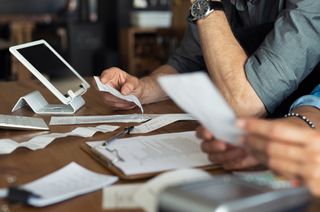 man looking at paperwork