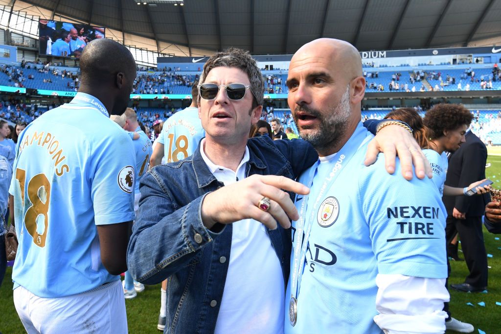 Noel Gallagher celebrates alongside Manchester City boss Pep Guardiola