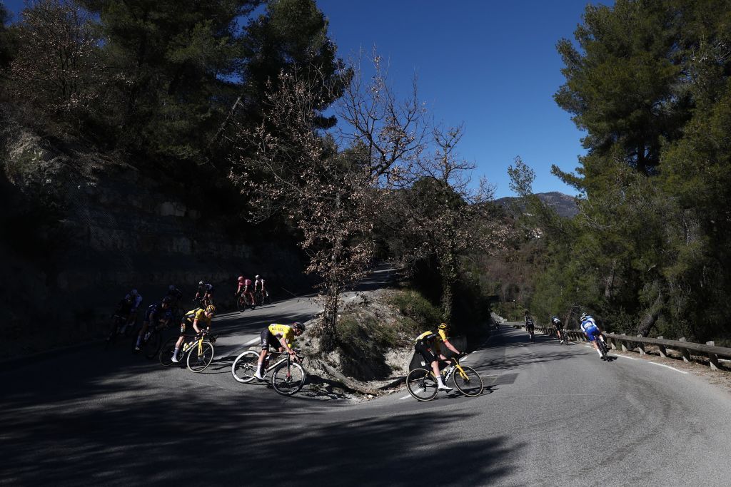 The pack of riders including UAE Team Emirates Slovenian rider Tadej Pogacar CL wearing the overall leaders yellow jersey and JumboVismas Belgian rider Nathan Van Hooydonck CR cycles during the 8th and final stage of the 81st Paris Nice cycling race 1175 km between Nice and Nice southeastern France on March 12 2023 Photo by AnneChristine POUJOULAT AFP Photo by ANNECHRISTINE POUJOULATAFP via Getty Images