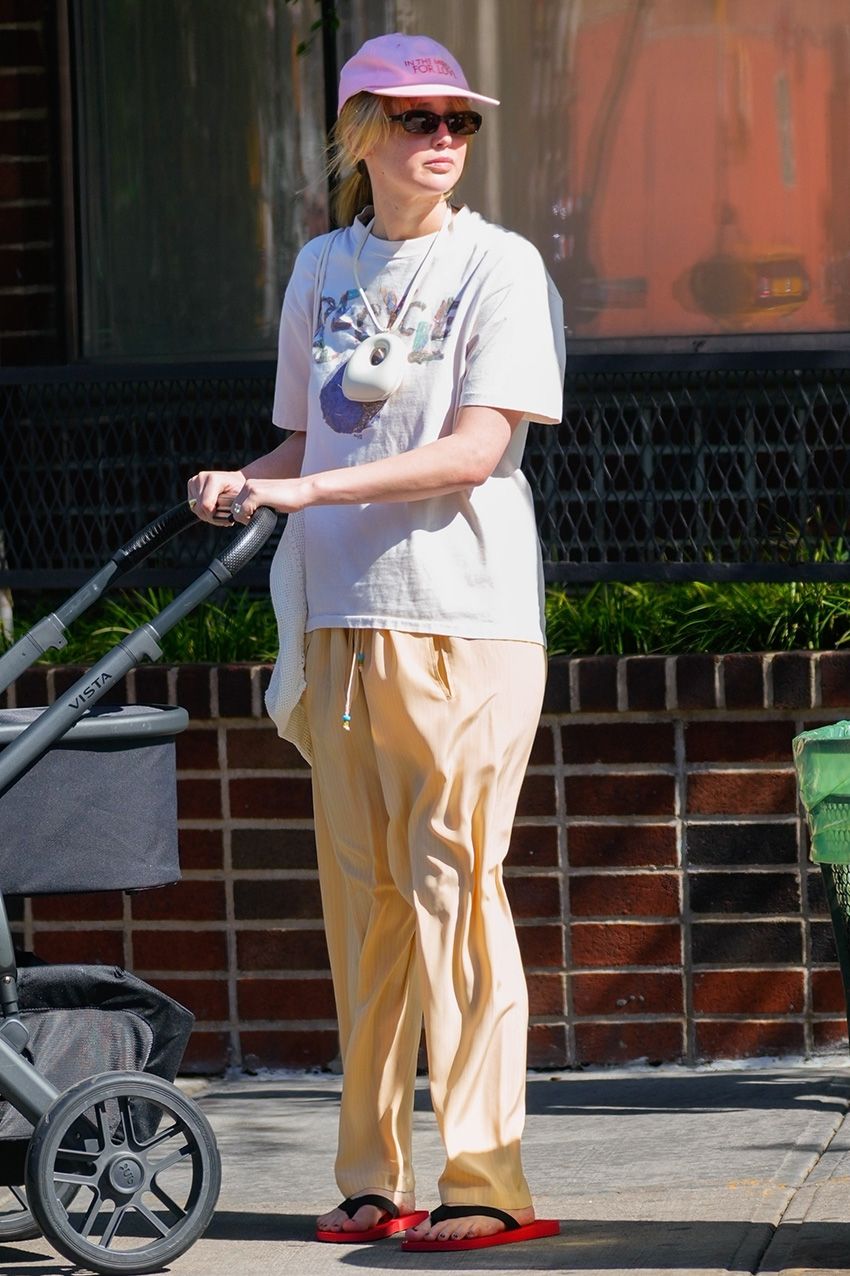 Jennifer Lawrence wearing a pink hat and T-shirt in NYC