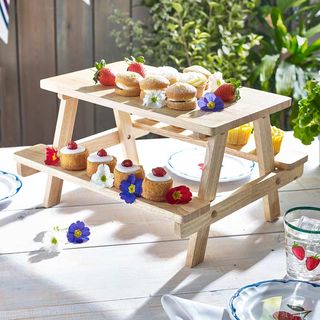 Jubilee decoration cake display on mini wooden picnic table stand