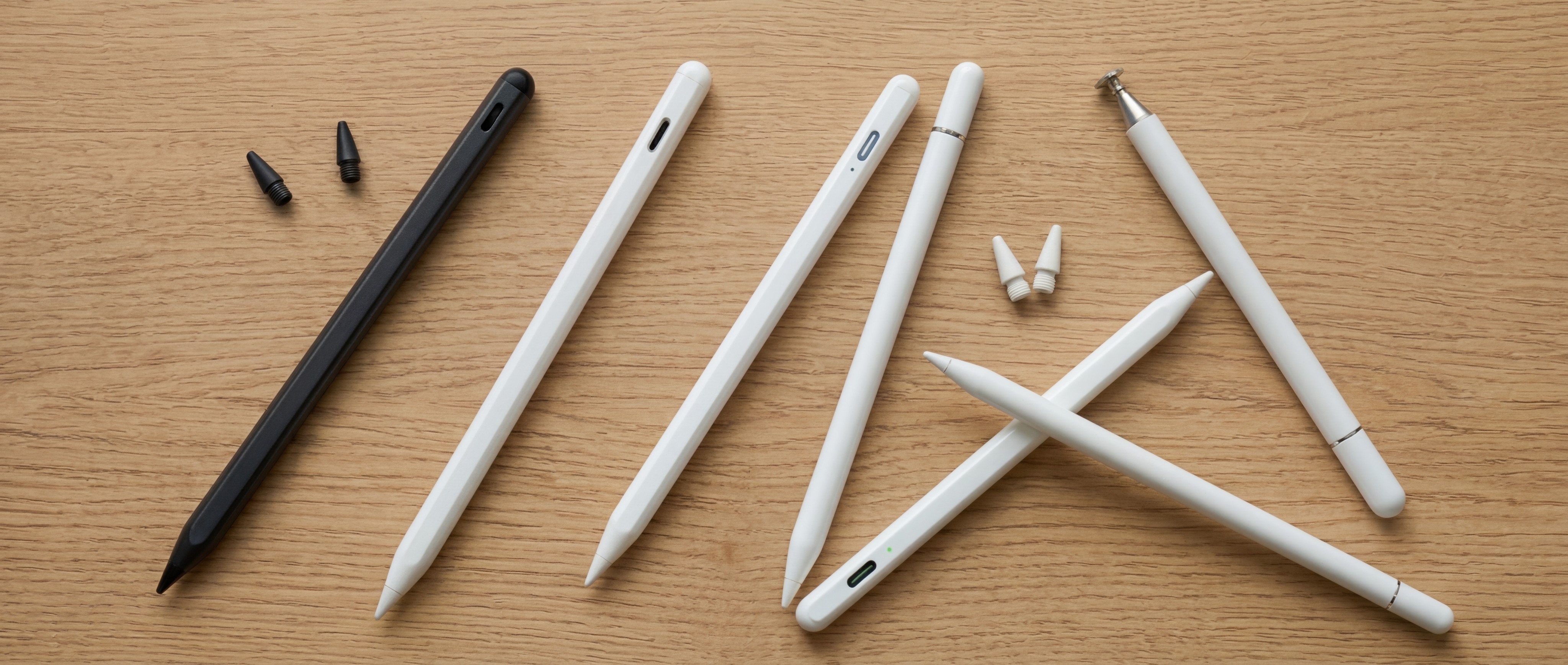 A selection of Apple Pencil alternatives arranged on a wooden table
