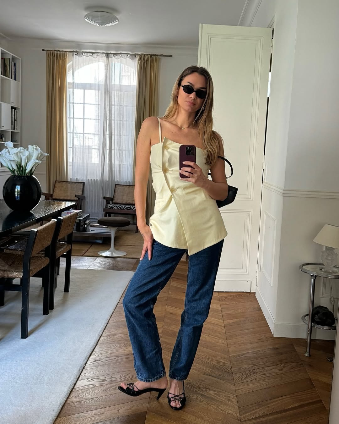 Anne-Laure Mais wearing dark wash jeans in Paris