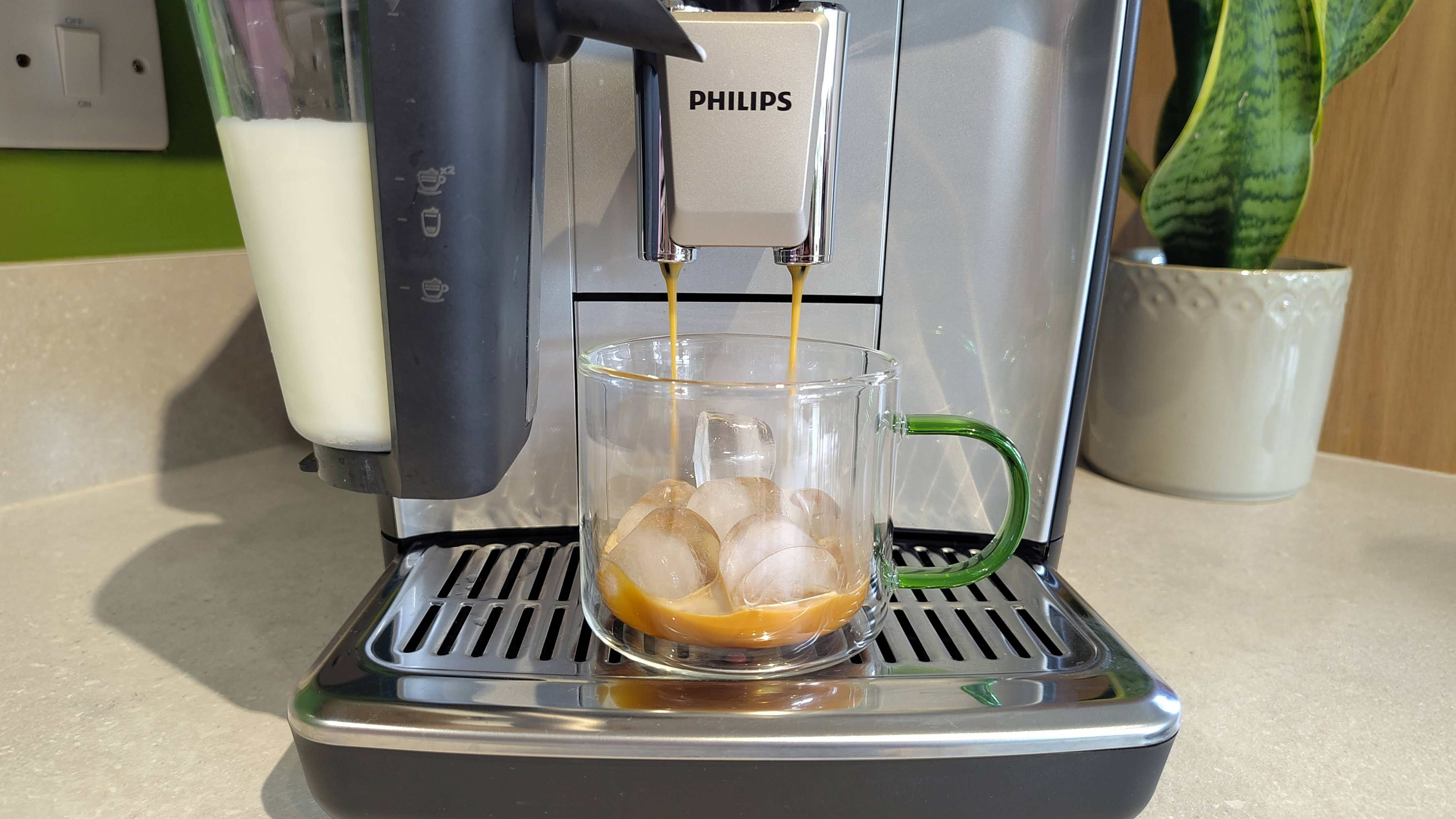 Philips LatteGo 5500 Series dispensing espresso onto ice cubes