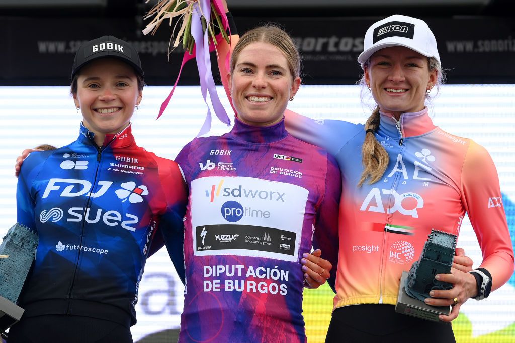 CANICOSA DE LA SIERRA SPAIN MAY 19 LR Evita Muzic of France and FDJ SUEZ Team on second place race winner Demi Vollering of The Netherlands and Team SD Worx Protime Purple Leader Jersey and Karlijn Swinkels of The Netherlands and UAE Team ADQ on third place pose on the podium ceremony after the 9th Vuelta a Burgos Feminas 2024 Stage 4 a 122km stage from Pearanda de Duero to Canicosa de la Sierra 1144m UCIWWT on May 19 2024 in Canicosa de la Sierra Spain Photo by Alex BroadwayGetty Images
