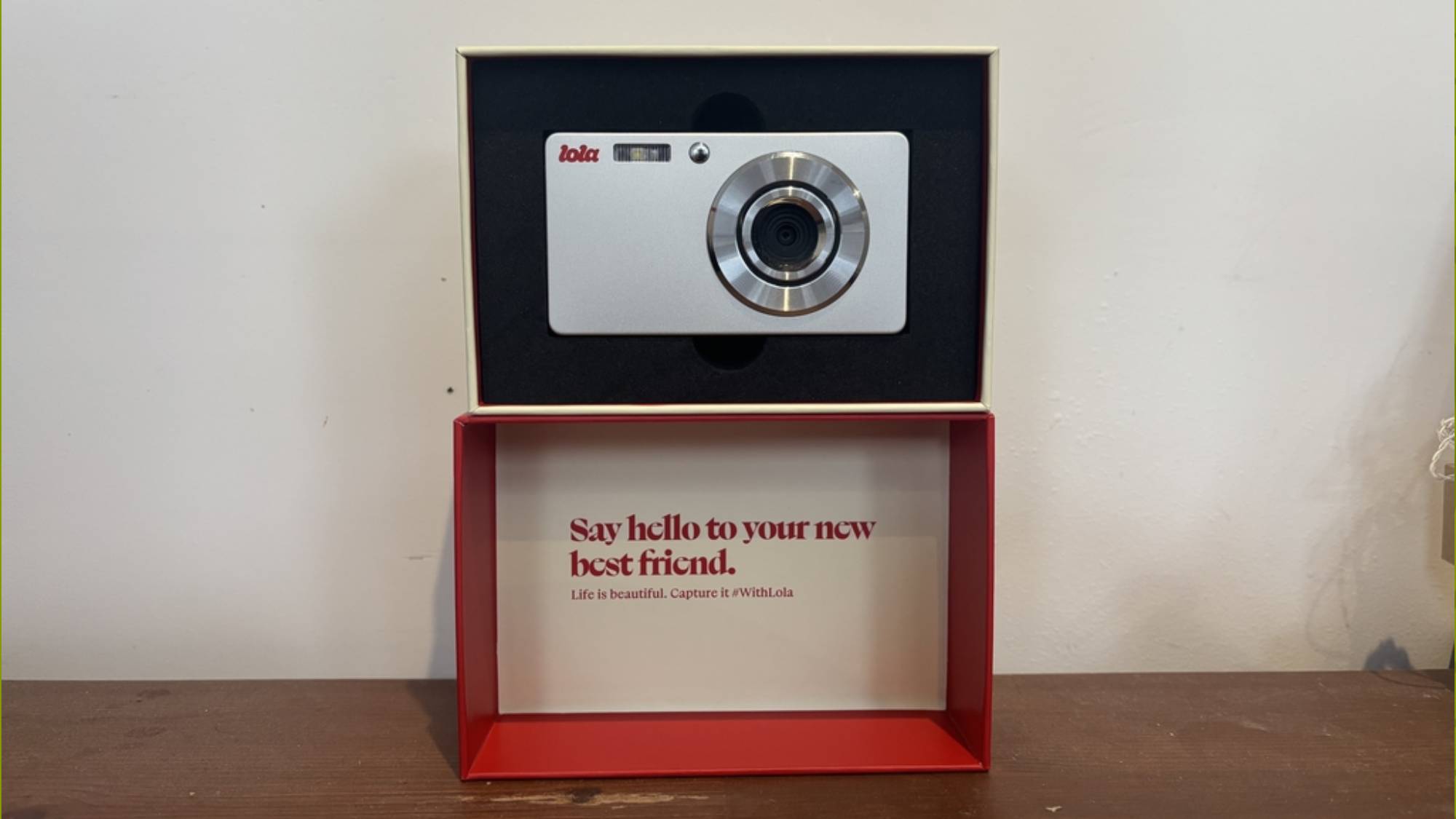 The Lola camera inside its box packaging