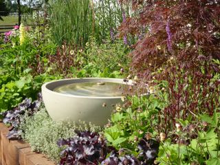 Water feature in a garden border