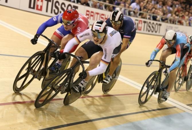 Stefan Boetticher (Germany) battles with Jason Kenny (GBr) in the final lap of the men's keirin final.