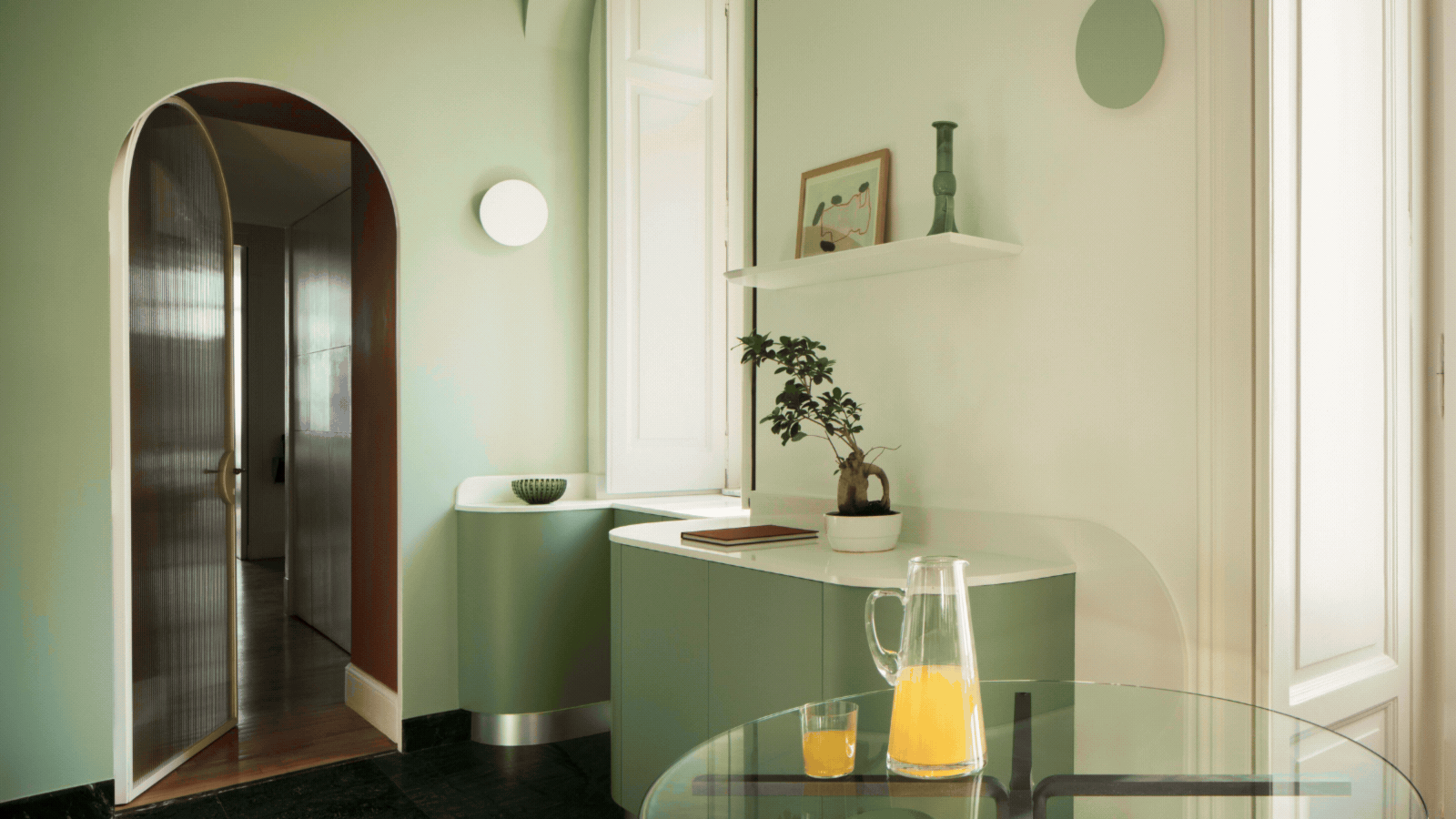 Rotating GIF of three luxury interior spaces that all have mint green somewhere on the walls or in the room. Each room is bright with other bright colors.